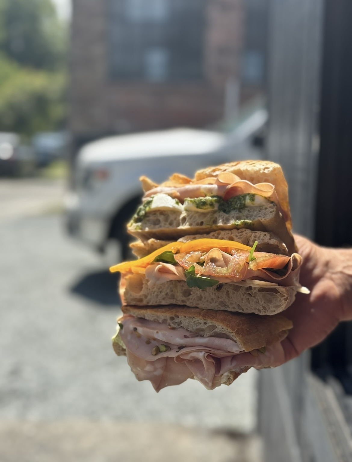 Schiacciata being pulled from the oven at Fortuna — the daily ritual